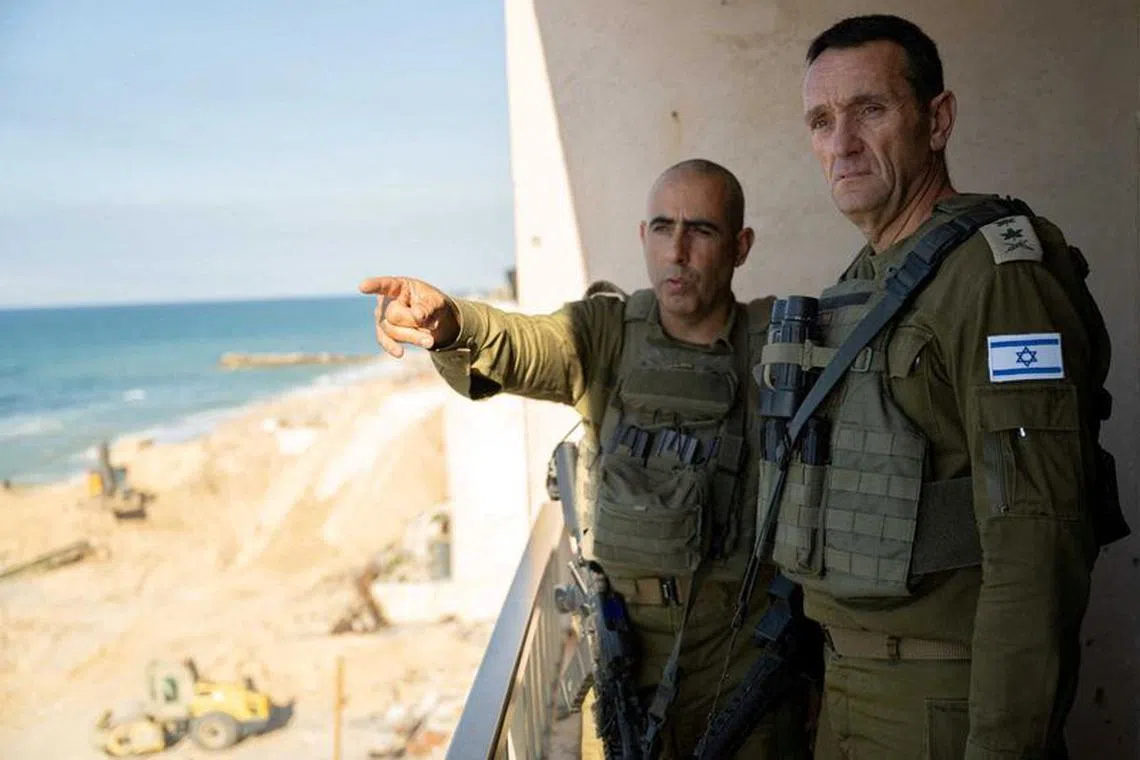 Israeli army Chief of Staff, Herzi Halevi listens to an officer as he visited soldiers during the ongoing ground operation of the Israeli army against Palestinian Islamist group Hamas, in a location given as Gaza, in this handout image released on November 16, 2023. Israel Defense Forces/Handout via REUTERS/File Photo