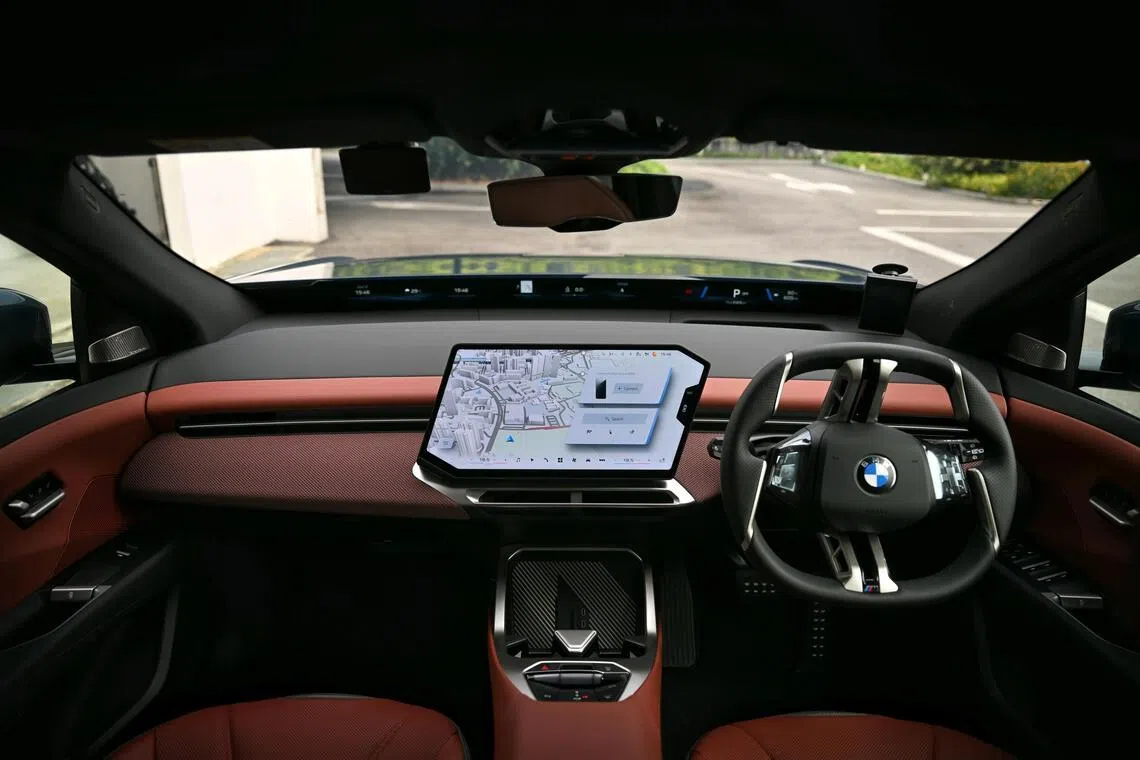 BMW’s unconventional steering wheel design and clever digital cockpit debut on the iX3.