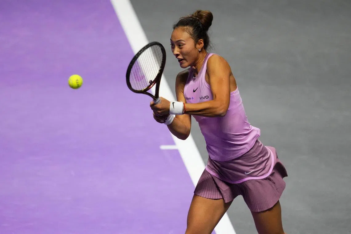 China's Zheng Qinwen during her singles group stage match against Italy's Jasmine Paolini at the WTA Finals.