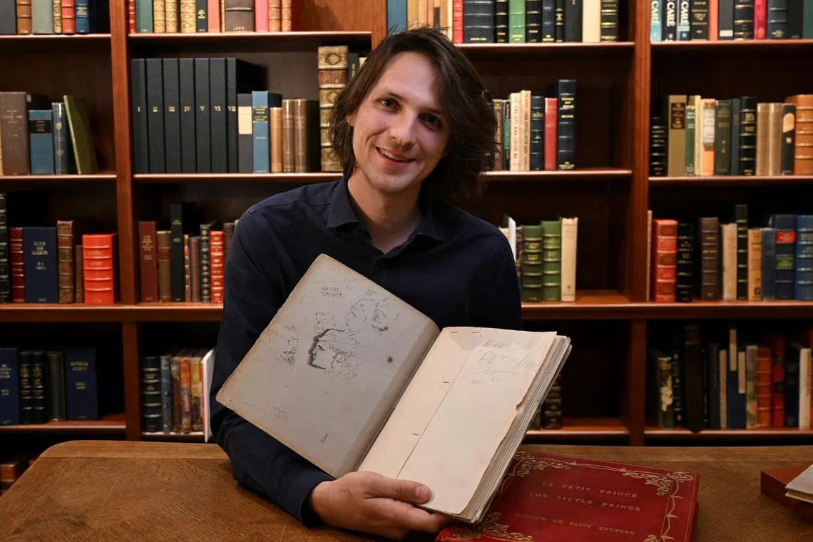 Mr Sammy Jay, Senior Literature Specialist at Peter Harrington Rare Books, with a rare carbon typescript of Antoine de Saint-Exupery's Le Petit Prince.