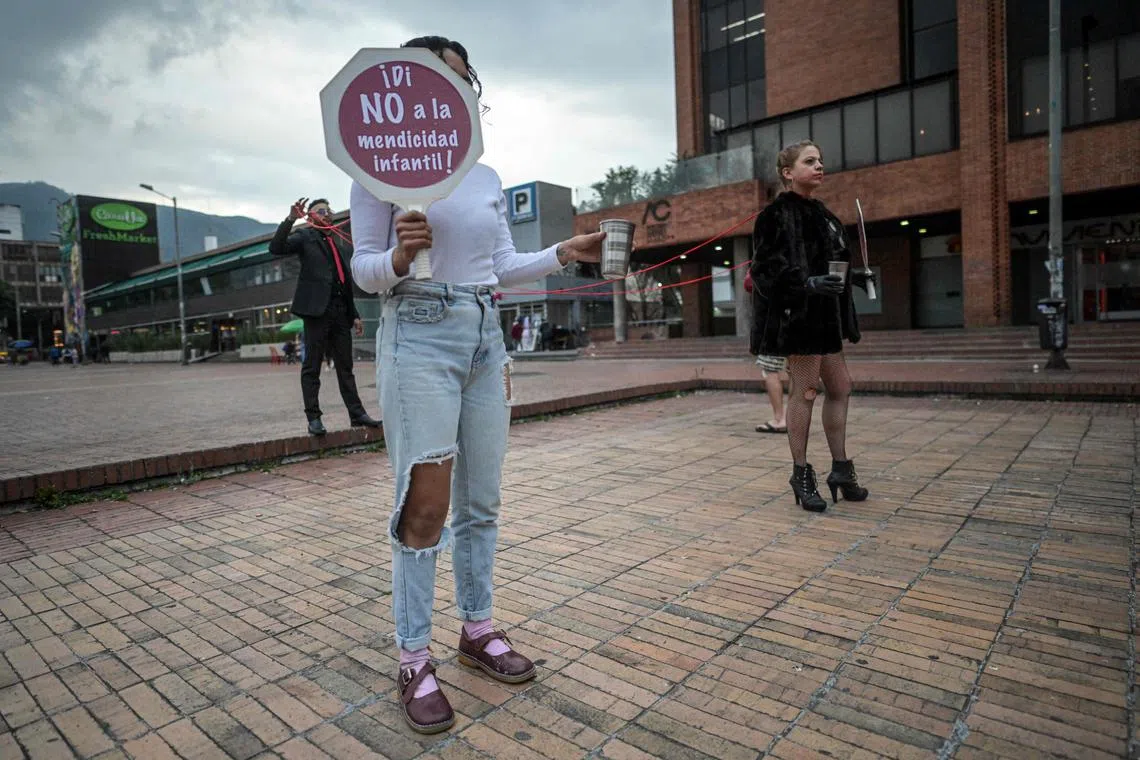 Members of the District Secretariat of Security carry out a performance against child prostitution and human trafficking in Bogota, Colombia on April 27. Colombian authorities arrested seven suspects as part of a global swoop across 44 countries.