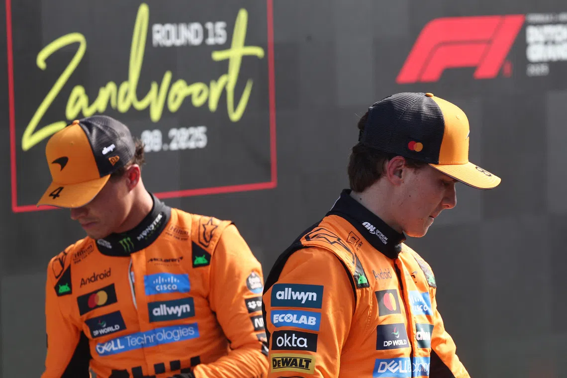 Formula One F1 - Dutch Grand Prix - Circuit Zandvoort, Zandvoort, Netherlands - August 30, 2025 McLaren's Oscar Piastri celebrates after qualifying in pole position with second placed McLaren's Lando Norris REUTERS/Jakub Porzycki