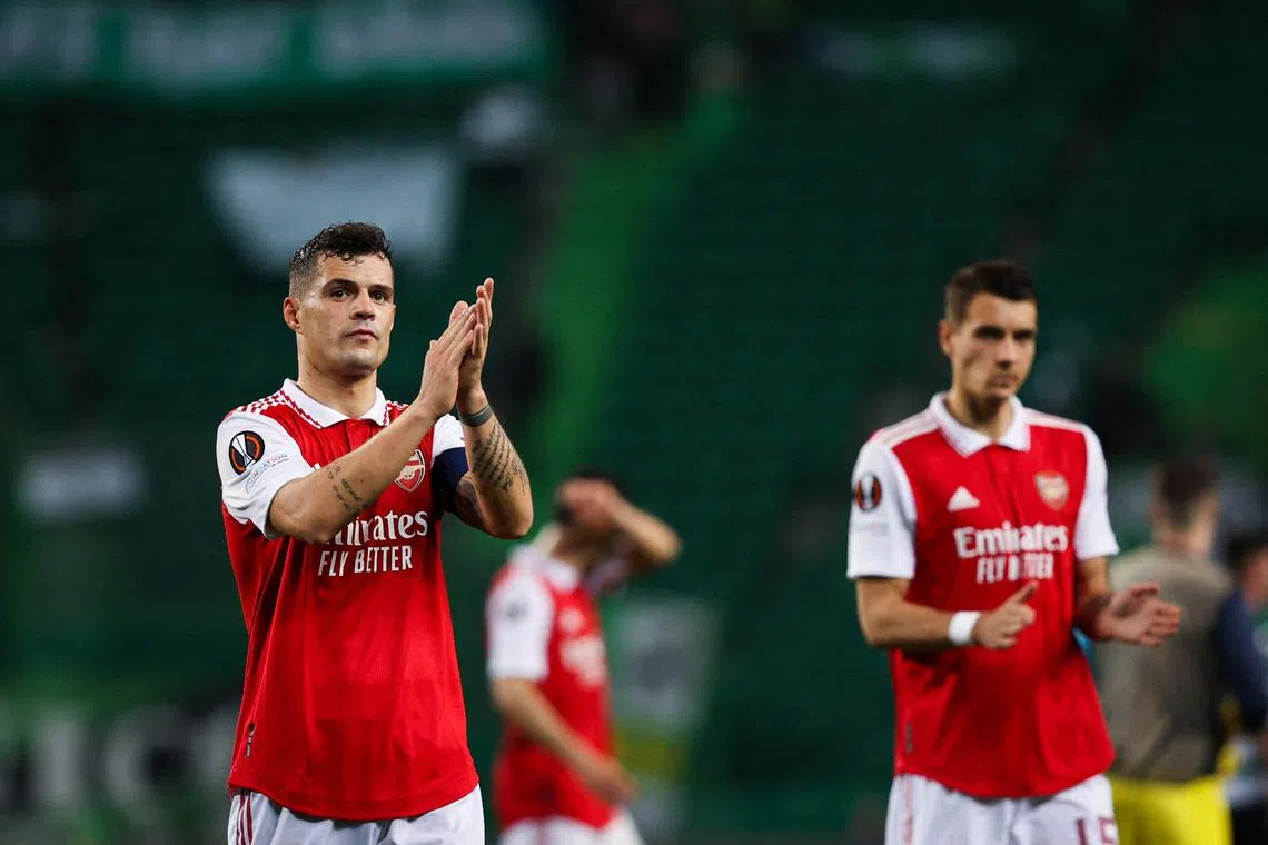 Arsenal's Granit Xhaka applauds fans at the end of the match.