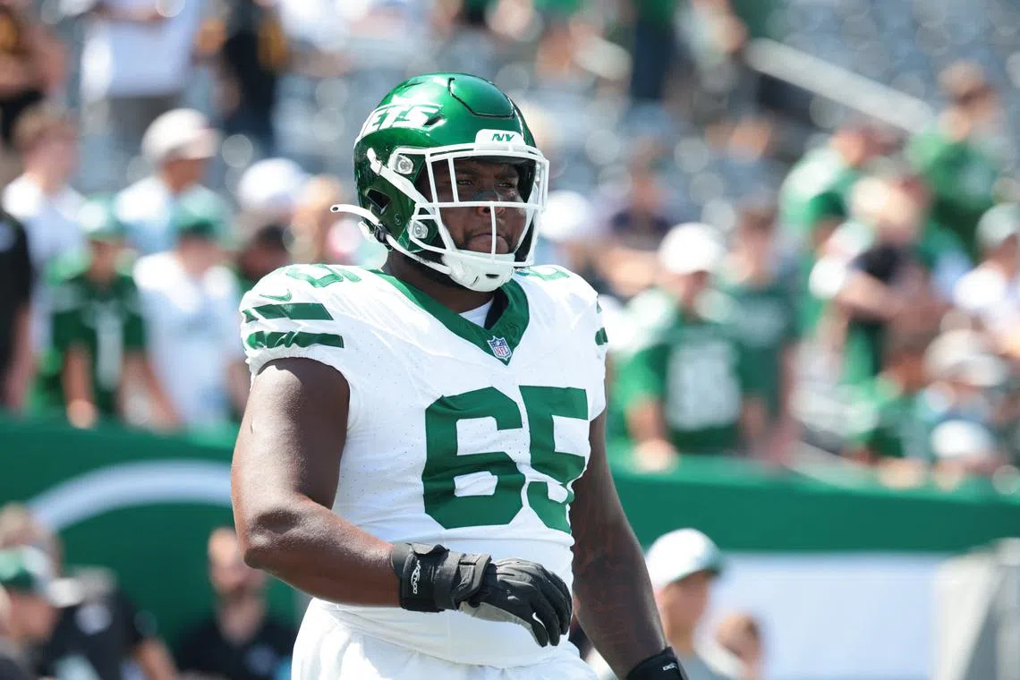 FILE PHOTO: Aug 10, 2024; East Rutherford, New Jersey, USA; New York Jets guard Xavier Newman (65) looks on before the game against the Washington Commanders at MetLife Stadium. Mandatory Credit: Vincent Carchietta-USA TODAY Sports/File Photo