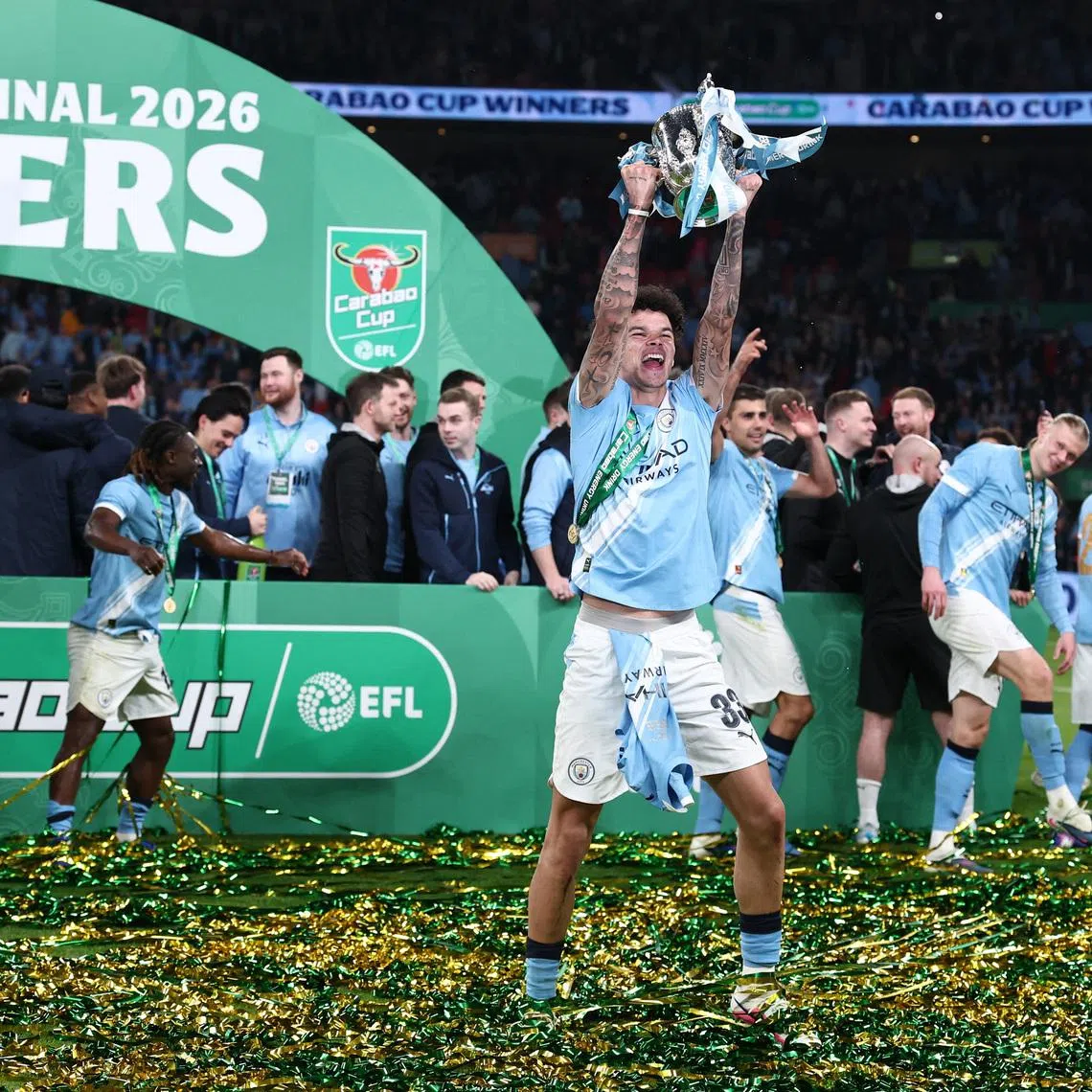 Soccer Football - Carabao Cup - Final - Arsenal v Manchester City - Wembley Stadium, London, Britain - March 22, 2026 Manchester City's Nico O'Reilly celebrates with the trophy after winning the Carabao Cup REUTERS/David Klein EDITORIAL USE ONLY. NO USE WITH UNAUTHORIZED AUDIO, VIDEO, DATA, FIXTURE LISTS, CLUB/LEAGUE LOGOS OR 'LIVE' SERVICES. ONLINE IN-MATCH USE LIMITED TO 120 IMAGES, NO VIDEO EMULATION. NO USE IN BETTING, GAMES OR SINGLE CLUB/LEAGUE/PLAYER PUBLICATIONS. PLEASE CONTACT YOUR ACCOUNT REPRESENTATIVE FOR FURTHER DETAILS..