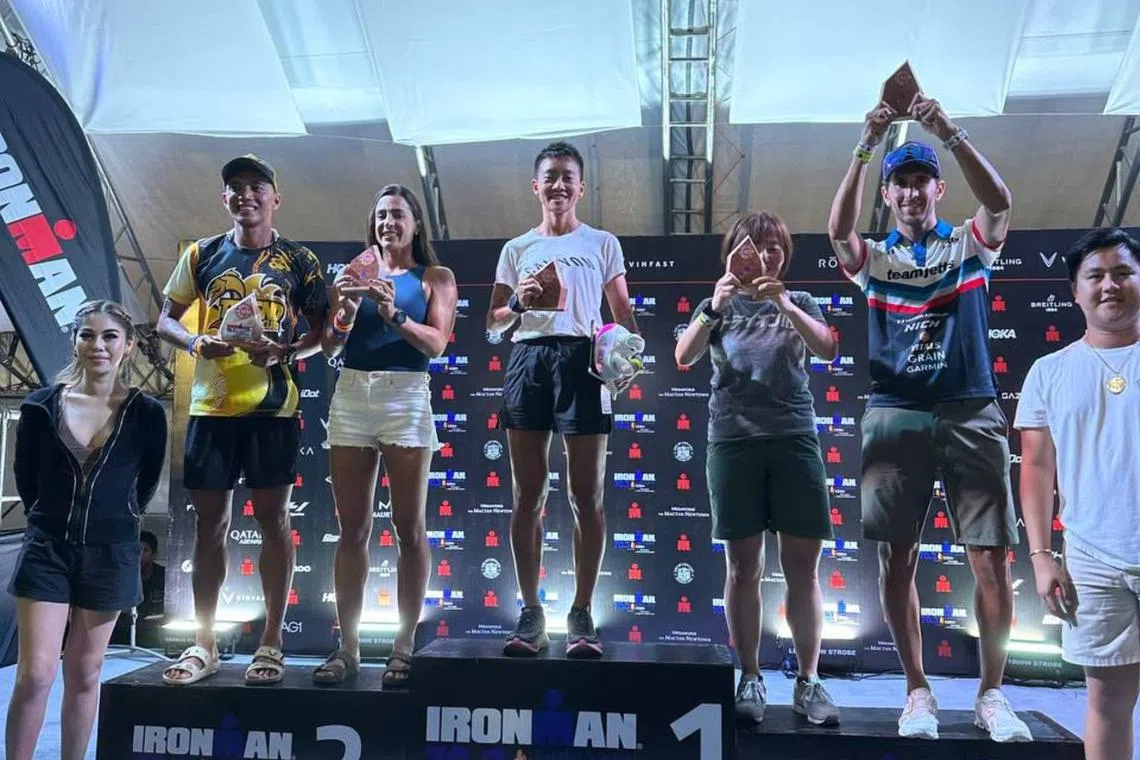 Choo Ling Er (centre) came in first in her age group in the Ironman 70.3 Lapu-Lapu in Cebu, the Philippines.