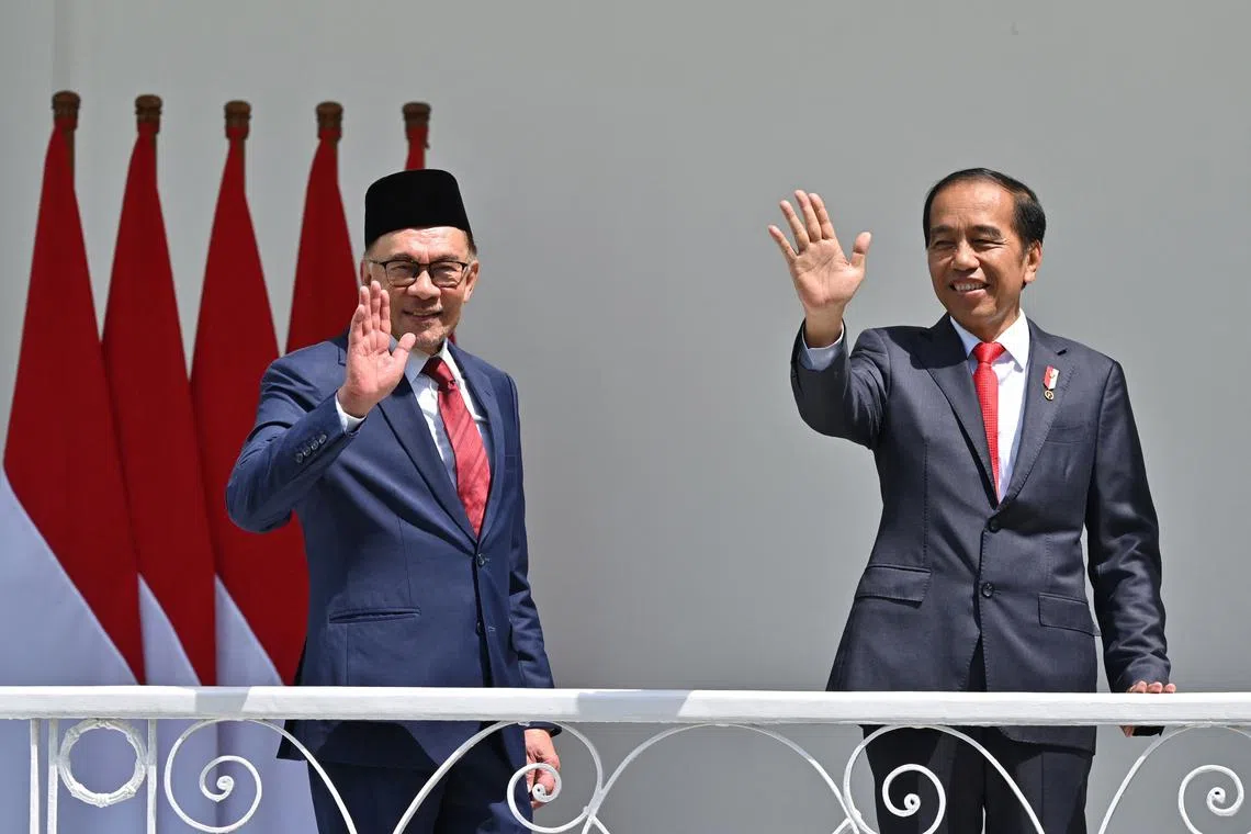 Malaysian Prime Minister Anwar Ibrahim (left) met with Indonesian President Joko Widodo on Monday on his first foreign trip.