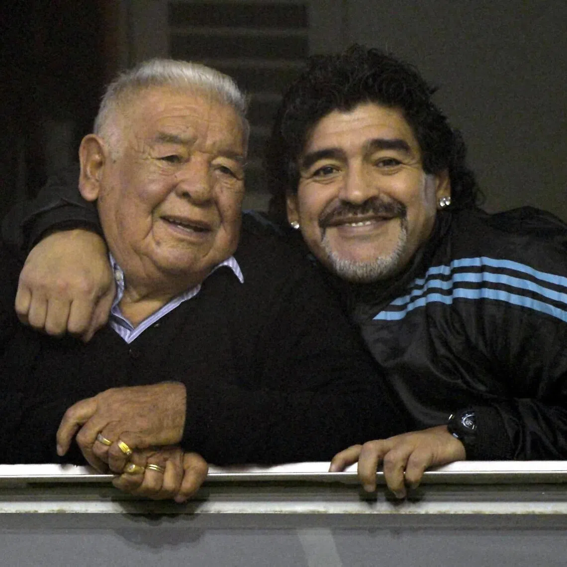 The late Argentine football star Diego Armando Maradona (right) embracing his father Diego Salustiano Maradona in this 2012 photo.