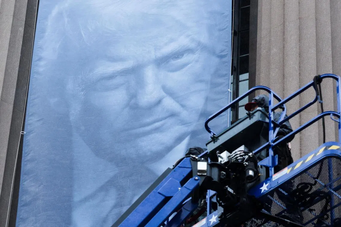 A new banner depicting U.S. President Donald Trump is hung on the Department of Justice building in Washington, D.C., U.S., February 19, 2026. REUTERS/Jonathan Ernst