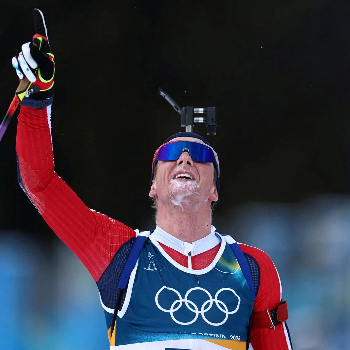 Johan-Olav Botn of Norway celebrates winning gold in the men's 20km individual biathlon.  REUTERS/Eloisa Lopez