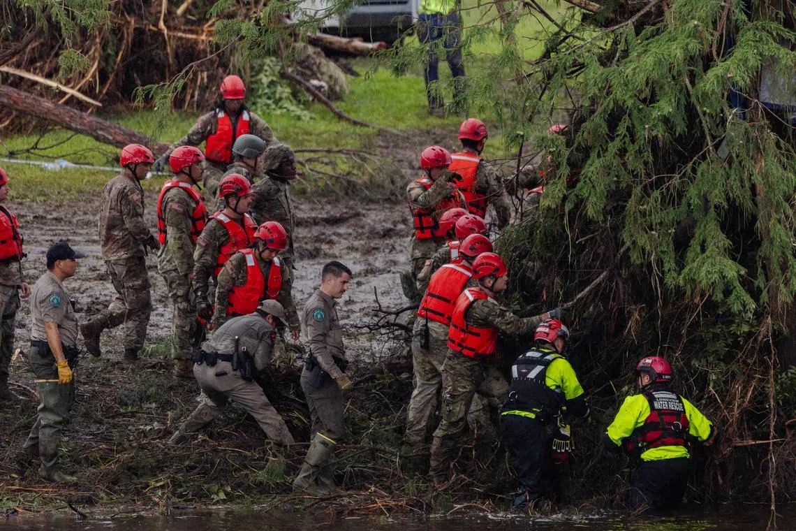 Search and recovery workers dig through debris looking for any survivors or remains of people swept up in the flash flooding at Camp Mystic in Hunt, Texas.  