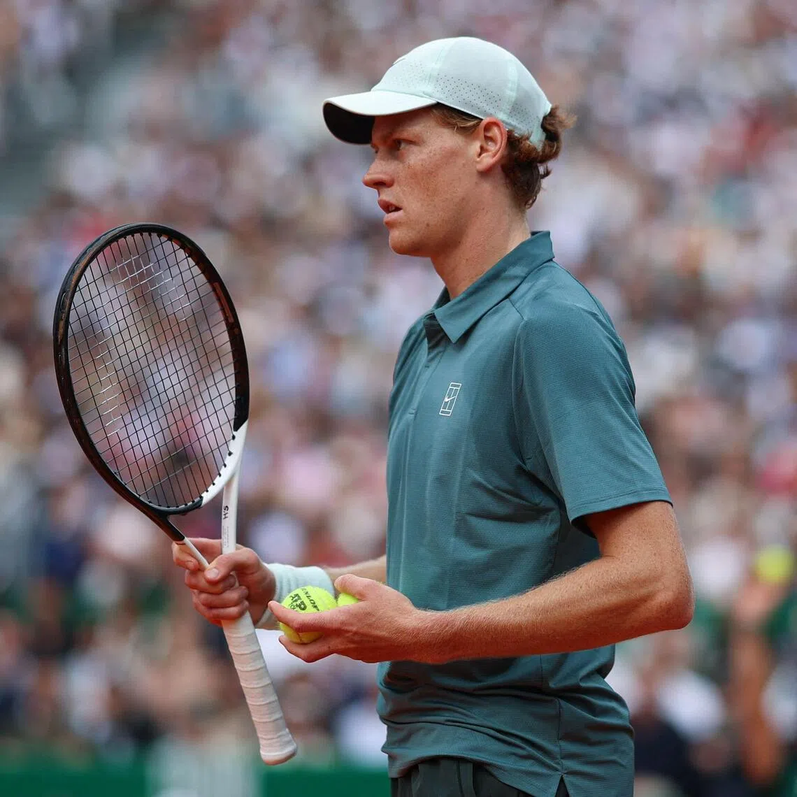 Italy's Jannik Sinner looks on as he plays against Spain's Carlos Alcaraz during the Monte Carlo ATP Masters Series Tournament final tennis match on Court Rainier III at the Monte-Carlo Country Club in Roquebrune-Cap-Martin, south-eastern France on April 12, 2026.
