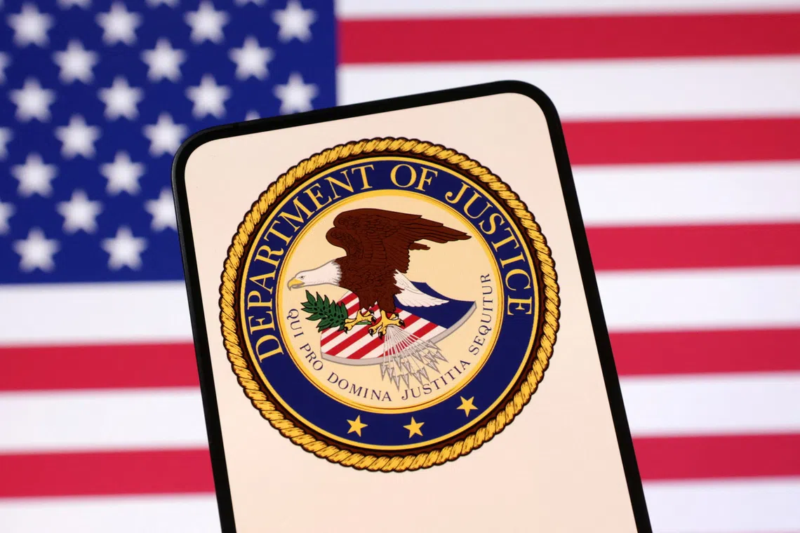United States Department of Justice logo and U.S. flag are seen in this illustration taken April 23, 2025. REUTERS/Dado Ruvic/Illustration