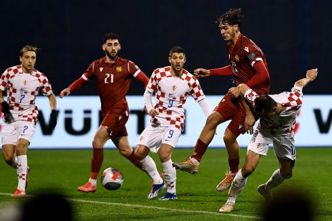 Croatia's forward Ante Budimir (far right) scoring the opening goal during the Euro qualifying match. 