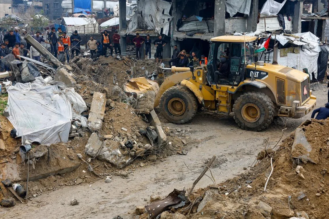 A search for victims going on in the northern Gaza Strip on Dec 12, after heavy rains caused a house to collapse.