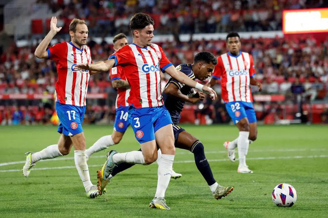 FILE PHOTO: Soccer Football - LaLiga - Girona v Real Madrid - Estadi Montilivi, Girona, Spain - September 30, 2023 Real Madrid's Rodrygo in action with Girona's Miguel Gutierrez REUTERS/Albert Gea/File Photo