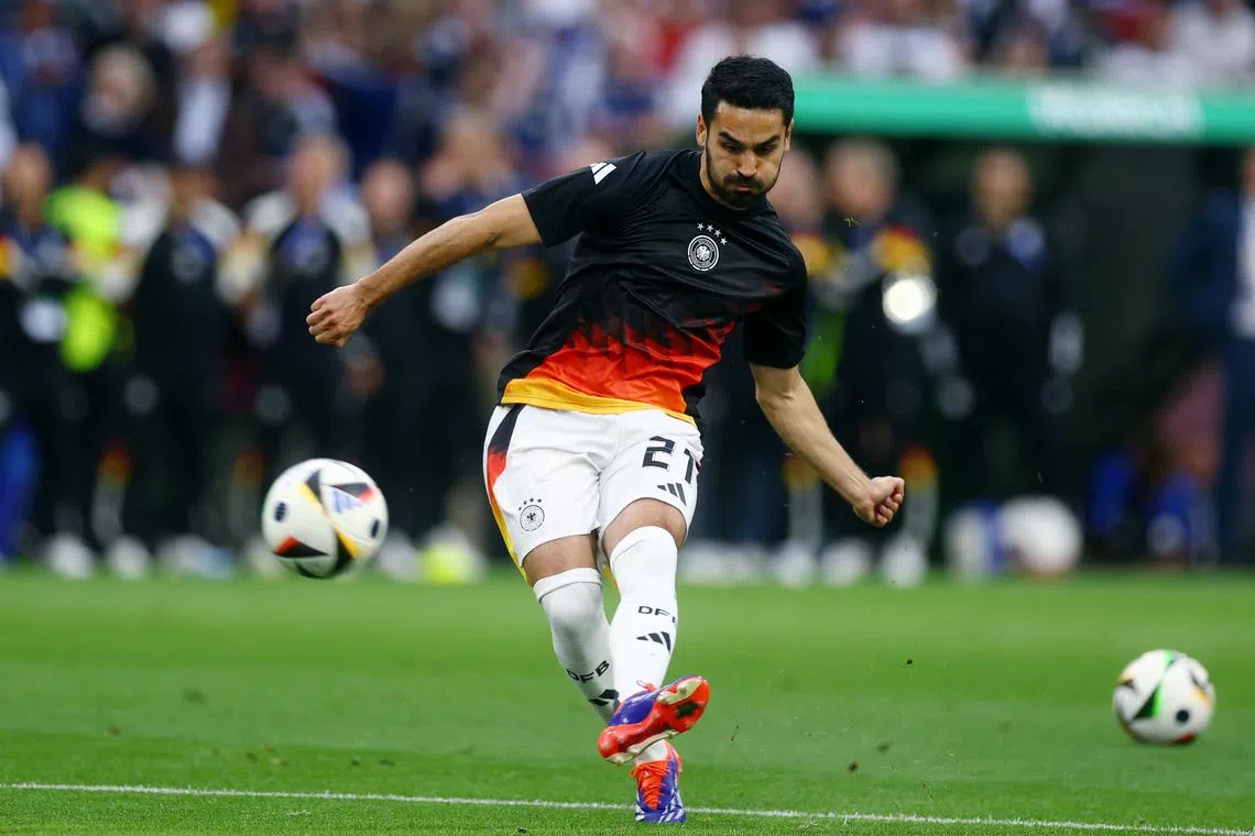 FILE PHOTO: Soccer Football - Euro 2024 - Group A - Germany v Scotland - Munich Football Arena, Munich, Germany - June 14, 2024   Germany's Ilkay Gundogan during the warm up before the match REUTERS/Lee Smith/File Photo