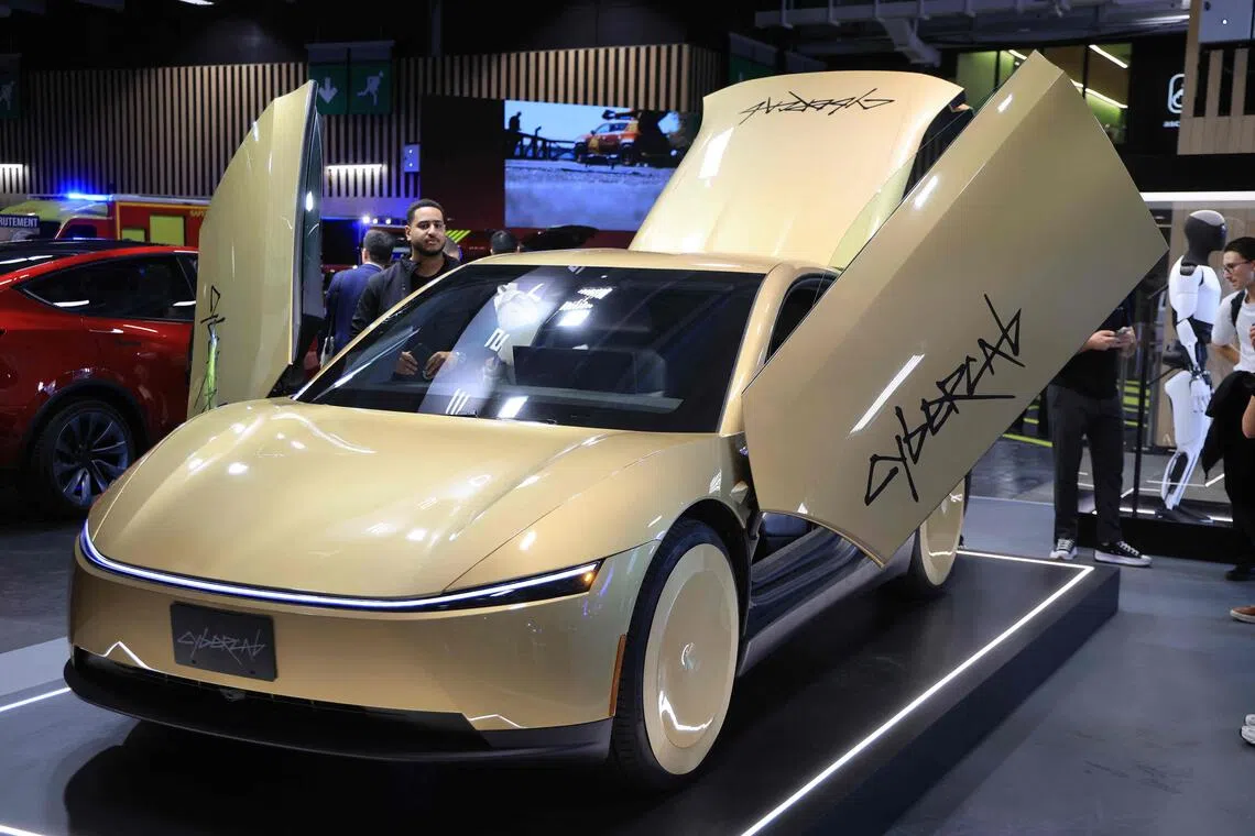 The gold, two-seater car features butterfly doors and drive themselves without any steering wheel, pedals or mirrors.