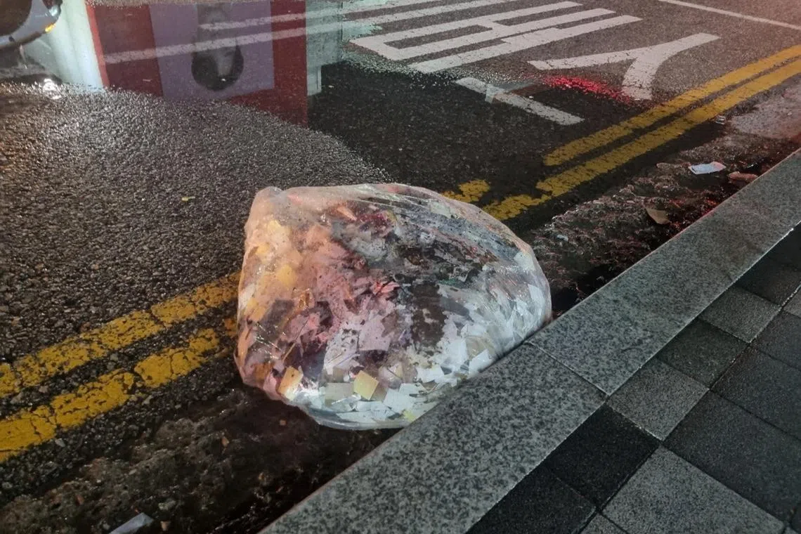 FILE PHOTO: A plastic bag carrying various objects including what appeared to be trash that crossed inter-Korean border with a balloon believed to have been sent by North Korea, is pictured in Seoul, in this picture provided and released by the Defense Ministry, June 2, 2024.  The Defense Ministry/Handout via REUTERS/ File Photo