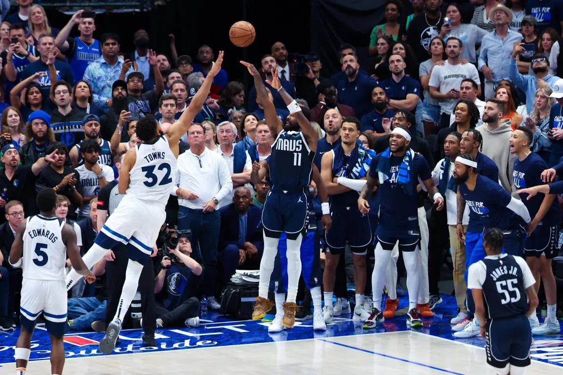 Dallas Mavericks guard Kyrie Irving scoring over Minnesota Timberwolves centre Karl-Anthony Towns during the fourth quarter during Game 3 of the Western Conference Finals at American Airlines Centre on May 26. He and Luka Doncic each had 33 points in Dallas' 116-107 win.
