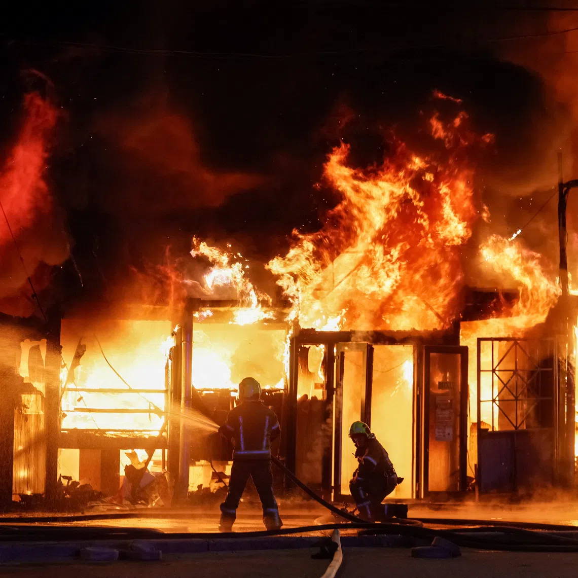 Firefighters work at a site of a book market hit by a Russian missile strike, amid Russia's attack on Ukraine, in Kyiv region, Ukraine August 16, 2026. REUTERS/Gleb Garanich