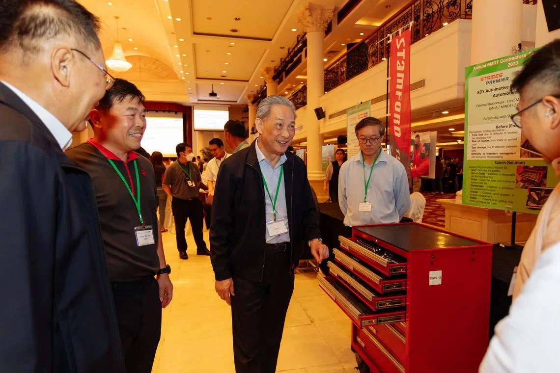 SMRT chairman Seah Moon Ming (centre) viewing exhibition booths at the inaugural SMRT Contractors' Safety Forum on July 14.
