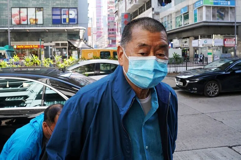 FILE PHOTO: Media mogul Jimmy Lai Chee-ying, founder of Apple Daily, reports to the police station after he was released on bail following his arrest under the national security law in Hong Kong, China December 2, 2020. REUTERS/Lam Yik/ FILE PHOTO