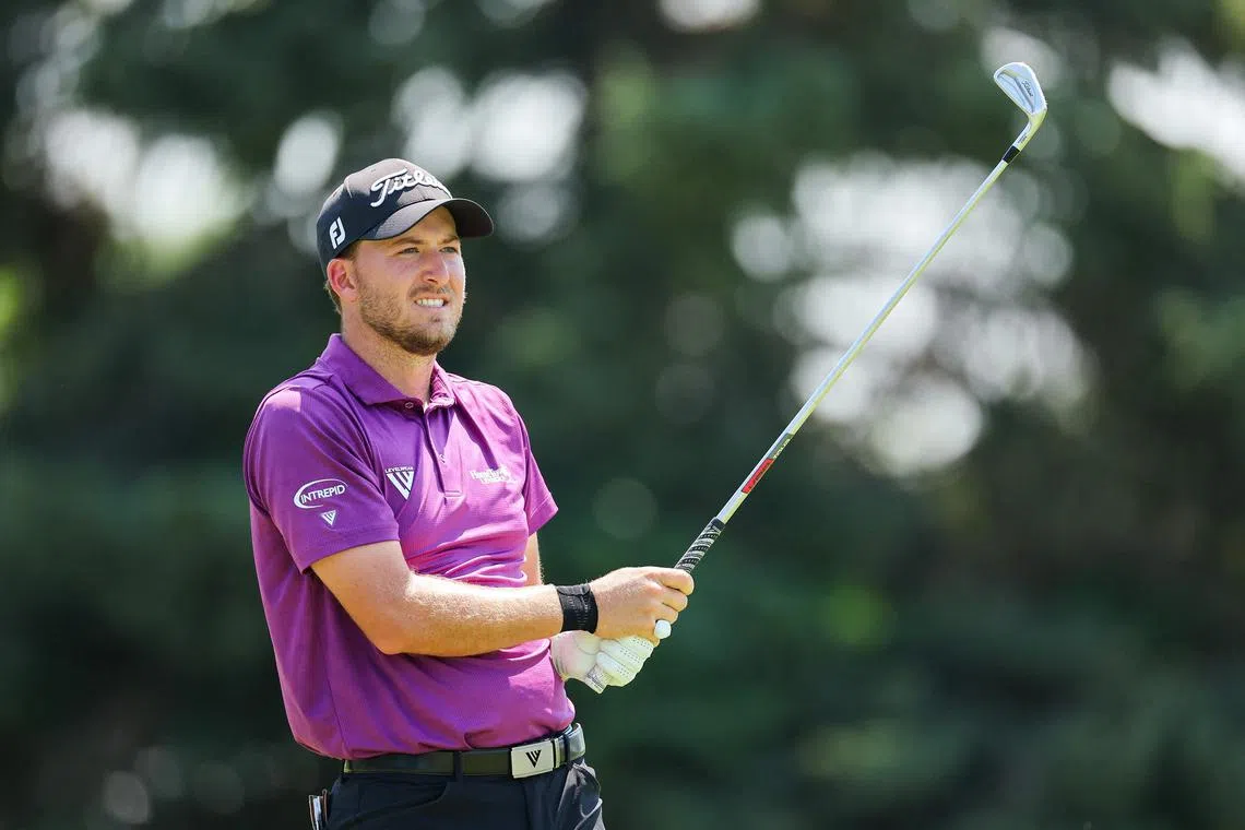Lee Hodges of the United States watches his shot from the eighth tee during the first round of the 3M Open.
