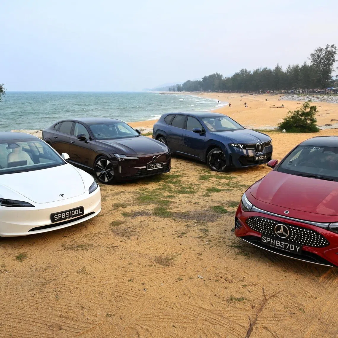 The Tesla Model 3 Long Range RWD, Volvo ES90 92kWh,BMW iX3 50 xDrive and Mercedes CLA 250+ after a 500km drive from Singapore, with another 1,500km to go.