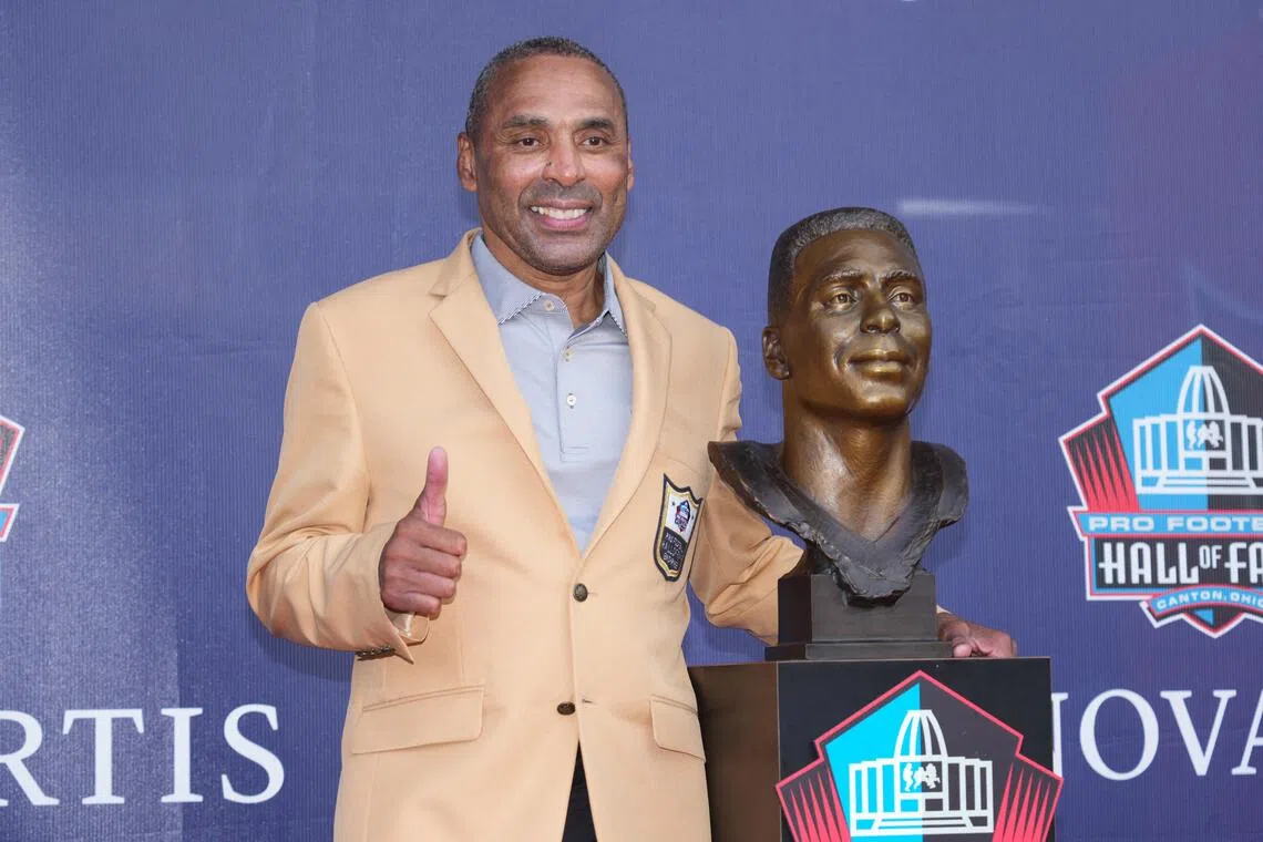 NFL Hall of Fame enshrinee Roger Craig posing on stage on Aug 8, during the Class of 2026 enshrinement ceremony at the Tom Benson Hall of Fame Stadium.