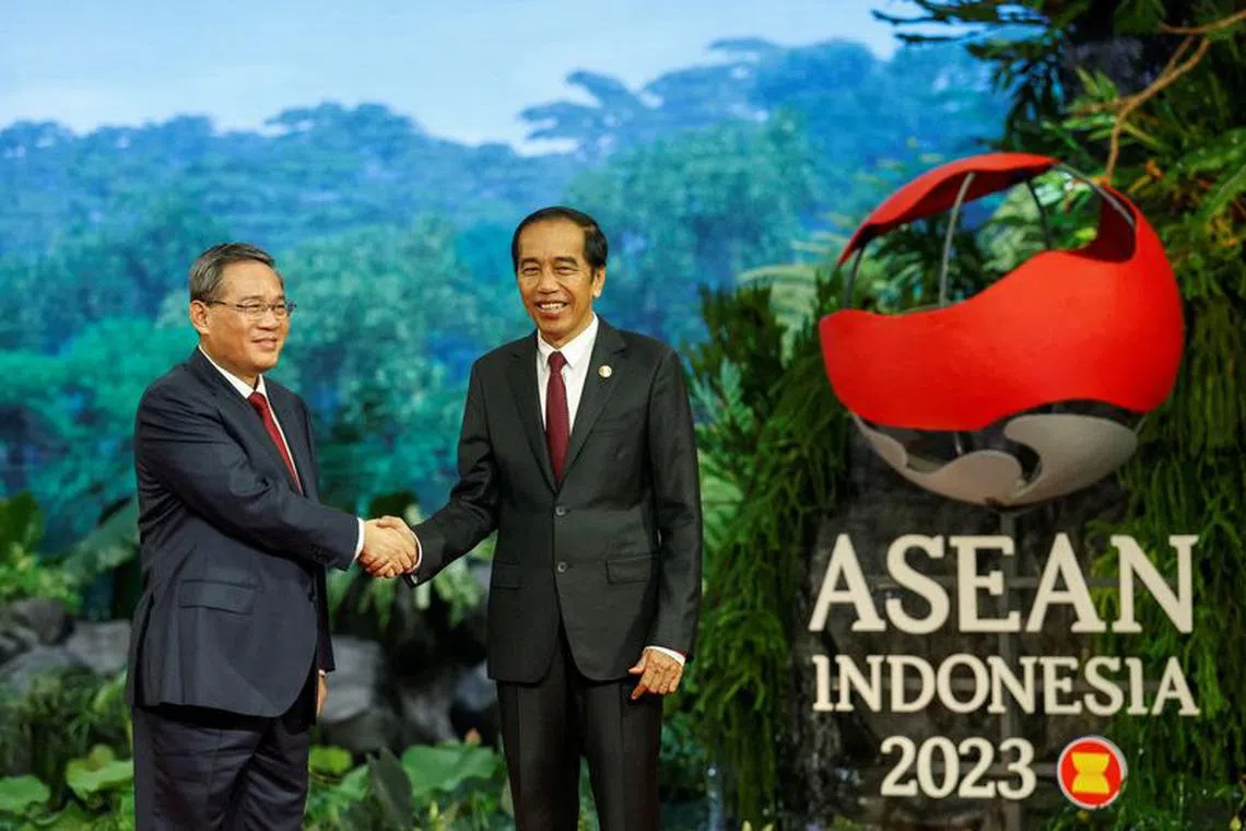 China's Premier Li Qiang (L) is greeted by Indonesia’s President Joko Widodo upon his arrival at the 43rd Association of Southeast Asian Nations (ASEAN) Summit in Jakarta, Indonesia, 06 September 2023. Indonesia will host the 43rd ASEAN Summit and related summits on 05 to 07 September 2023.    MAST IRHAM/Pool via REUTERS
