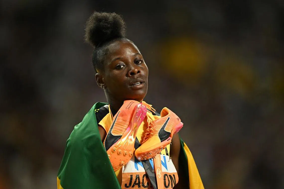 Athletics - World Athletics Championship - Women's 200m Final - National Athletics Centre, Budapest, Hungary - August 25, 2023 Jamaica's Shericka Jackson reacts after winning gold in the women's 200m final REUTERS/Dylan Martinez