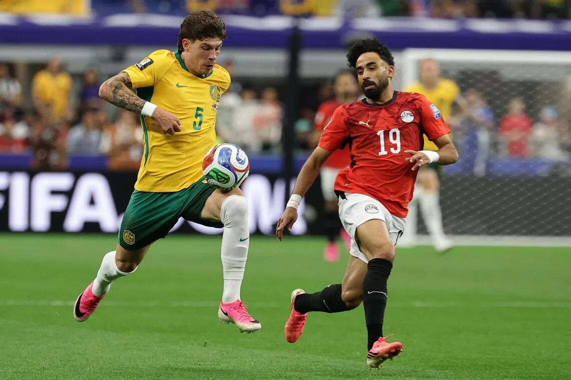 Jordan Bos (left) of Australia and Egypt’s Marawan Attia in action during a World Cup round of 32 match which Egypt won on penalties.