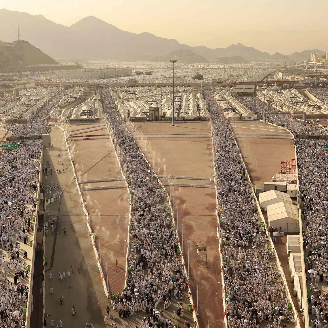 Muslim pilgrims arrive to perform the symbolic "stoning of the devil" ritual as part of the haj pilgrimage in Mina, near Saudi Arabia's holy city of Mecca, on June 16, 2024. 
