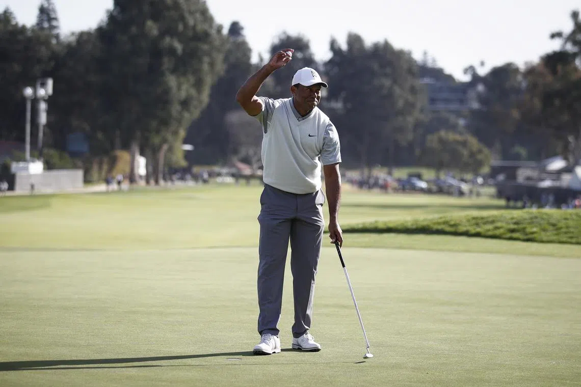 Tiger Woods acknowledging the crowd after completing the ninth hole during the third round of the Genesis Invitational on Saturday. 