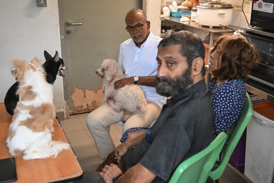 Animal Lovers League co-founders Mohan Div (in black shirt) and Cathy Strong with Minister for Home Affairs and Coordinating Minister for National Security K. Shanmugam on Dec 10.