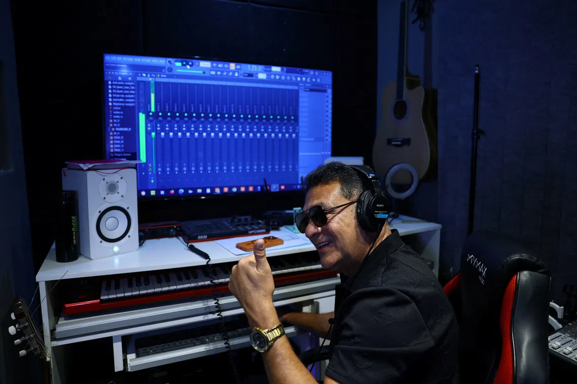 MC Bob Rum, who wrote the original 1995 song \"Rap do Silva,\" which was adapted in July 2026 as a campaign jingle highlighting the working-class roots of President Luiz Inacio Lula da Silva during his presidential campaign, gestures while listening to a music during an interview with Reuters at his studio in Rio de Janeiro, Brazil, August 10, 2026. REUTERS/Pilar Olivares