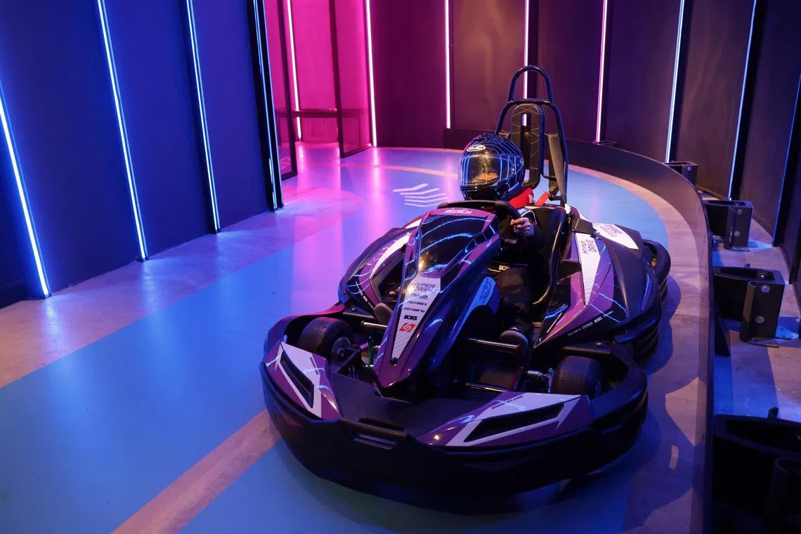 ST20230827_202323130366 : Gin Tay/ edsep/ Eddino Abdul Hadi/
Aira Eddino, (right)10, poses in an electric go-kart before her ride at HyperDrive, Aug 27, 2023.

///The newly opened beach front destination Palawan @ Sentosa by Shangri-La features activities such as an electric go-kart circuit, HyperDrive, an 18-hole mini golf course, as well as a water play area complete with slides and plunge pools.