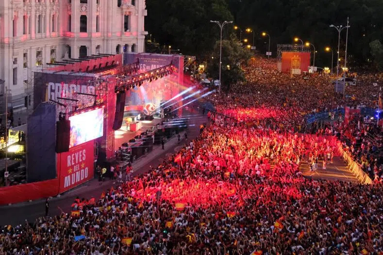 Spain fans gather at Cibeles Square in Madrid during the victory parade as they celebrate after winning the World Cup.