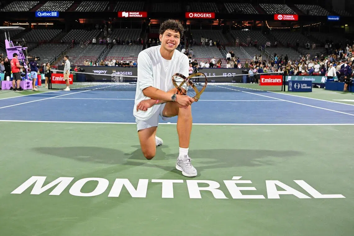Ben Shelton of the United States posing with the trophy after his victory over compatriot Brandon Nakashima in the men’s singles final at the ATP 1000 National Bank Open on Aug 13 in Montreal, Canada.