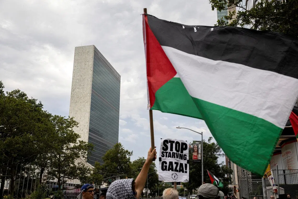 FILE PHOTO: People rally in front of the United Nations headquarters during a \"Stop Starving Gaza Now\" protest amid the ongoing conflict between Israel and Hamas, in New York City, U.S., July 25, 2025. REUTERS/Christian Monterrosa/File Photo