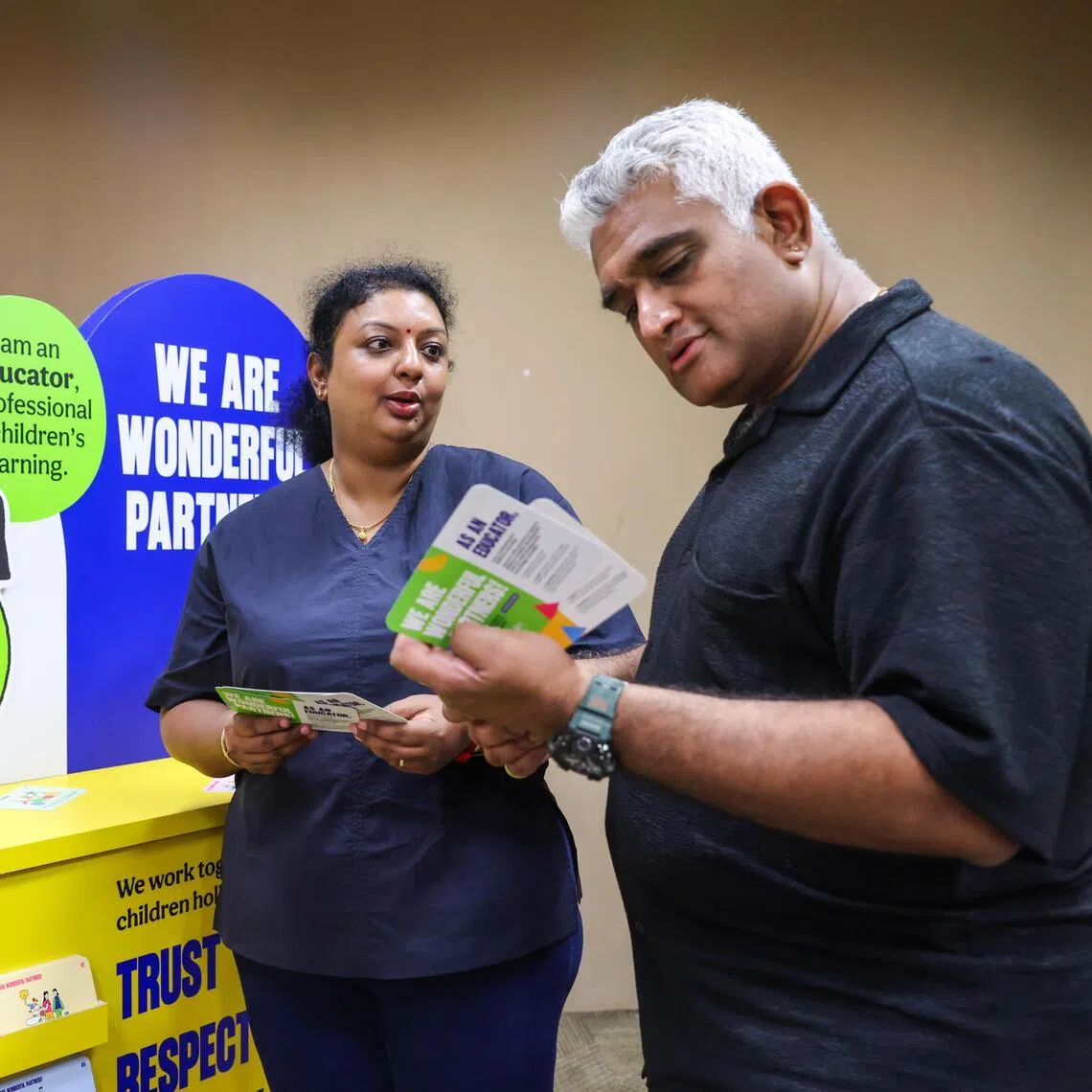 Nithiyasri Subramaniam and her husband Daeshar reading the guide on July 18.