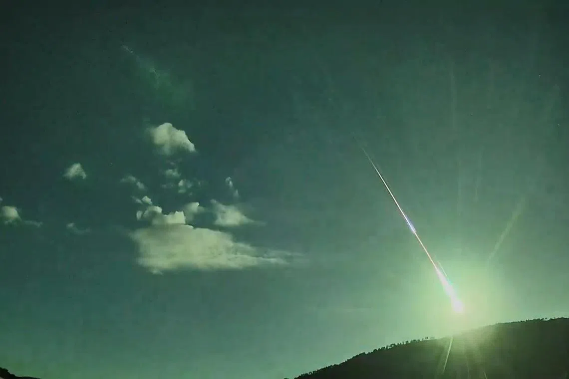 A comet fragment lights up the skies as seen from Caceres, Spain on May 18, 2024 in this still image taken from social media video. 
