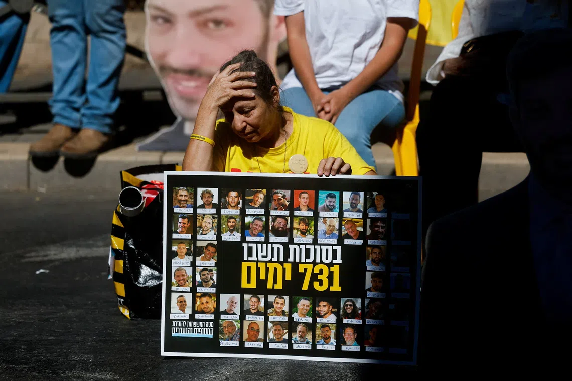 A woman reacts as families of Israeli hostages and supporters protest outside Israeli Prime Minister Benjamin Netanyahu's residence, marking the two-year anniversary of the deadly October 7, 2023 attack on Israel by Hamas from Gaza, in Jerusalem, October 7, 2025. REUTERS/Ammar Awad