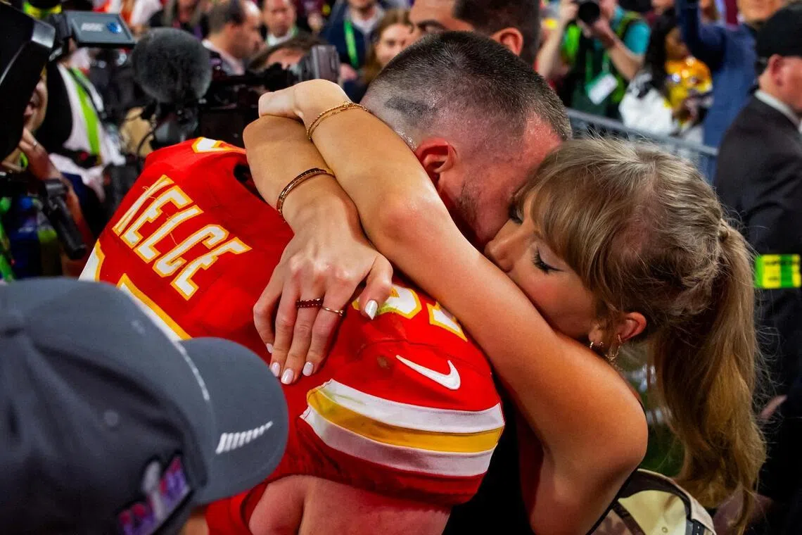 Travis Kelce celebrates with pop megastar Taylor Swift after defeating the San Francisco 49ers in Super Bowl LVIII in 2024.