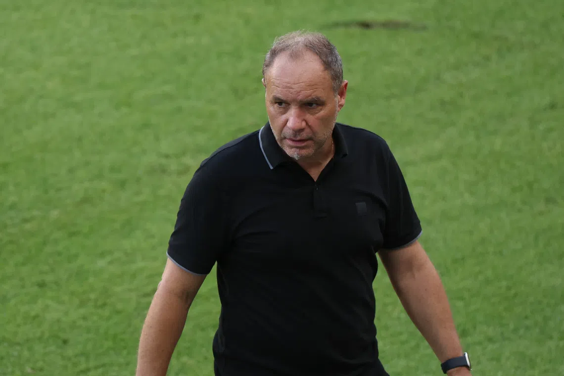 Jun 19, 2025; Houston, Texas, USA; Haiti head coach Sebastien Migne walks the sidelines during the second half against Trinidad and Tobago of a group stage match of the 2025 Gold Cup at Shell Energy Stadium. Mandatory Credit: Thomas Shea-Imagn Images