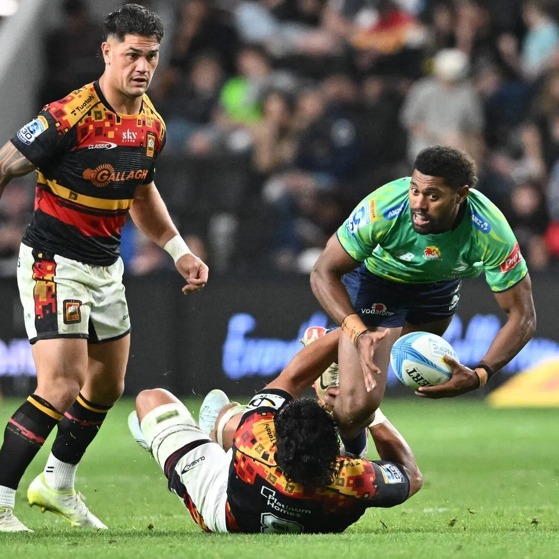 Fijian Drua's Ilaisa Droasese is tackled by Waikato Chiefs' defence in the Super Rugby Pacific match at One New Zealand Stadium in Christchurch on April 26, 2026.