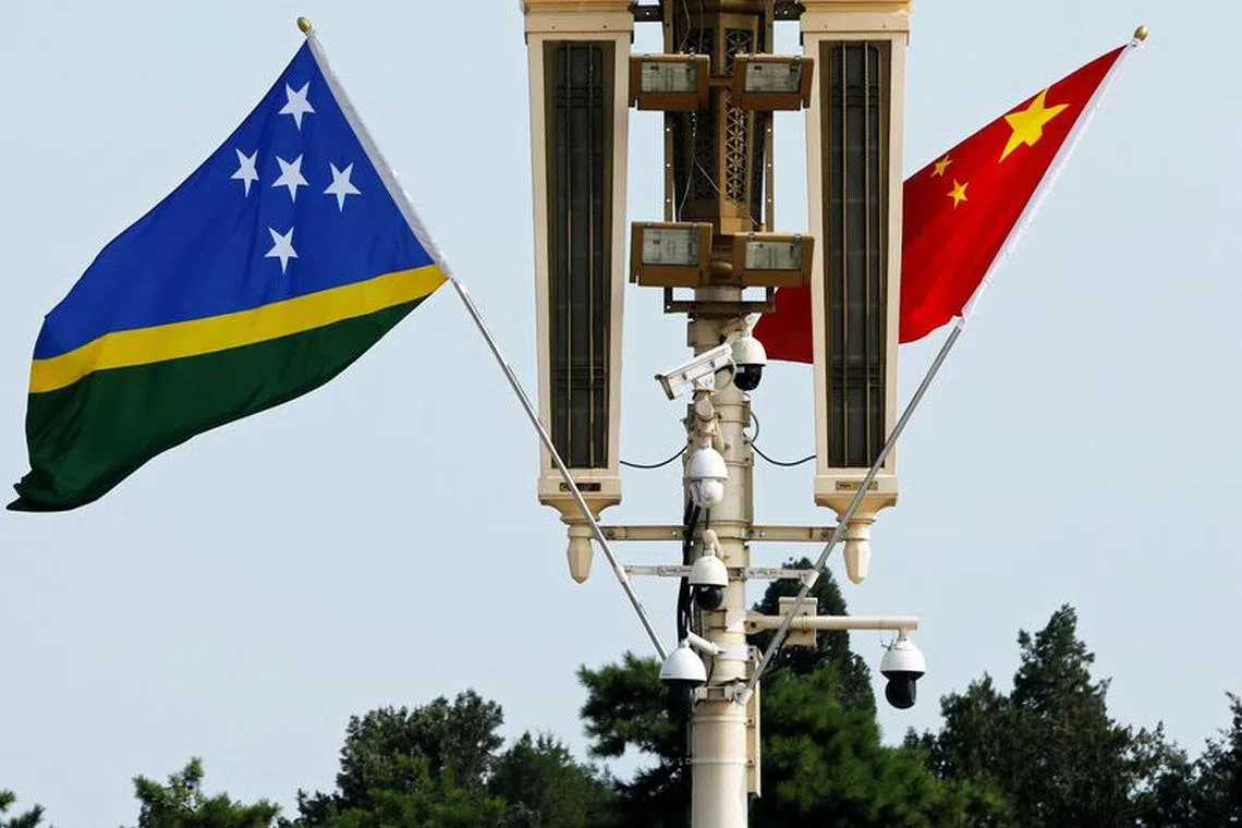 File photo: Flags of Solomon Islands and China flutter near the Tiananmen Gate in Beijing, China July 11, 2023. REUTERS/Florence Lo/File photo