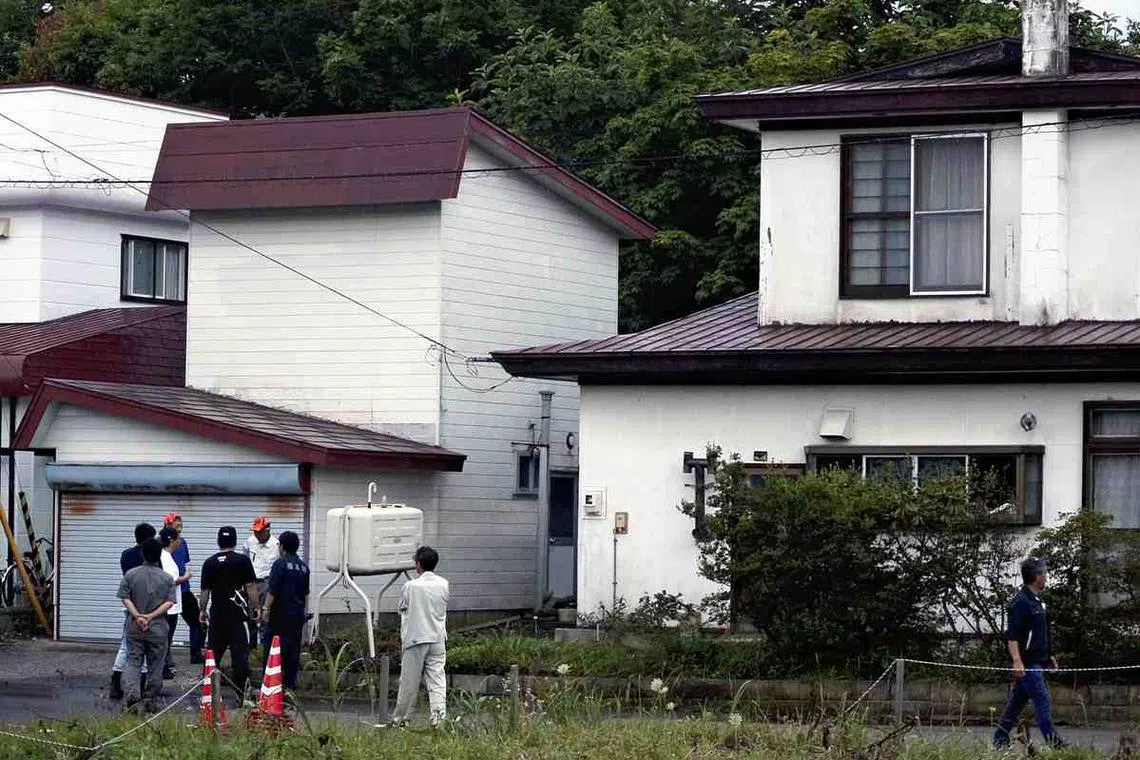 People are seen at the site where a brown bear was killed in Fukushima, Hokkaido, on July 18, 2025.