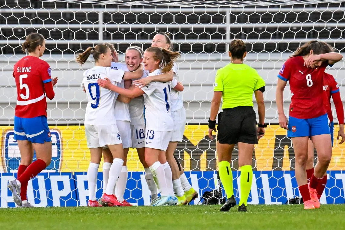 Finland players celebrating during their Nations League soccer match against Serbia  on June 3.